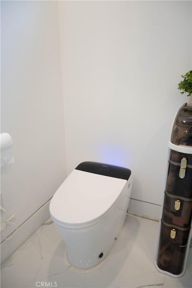 9359 Cecilia St, Downey, CA 90241 - bathroom featuring marble finish flooring and toilet