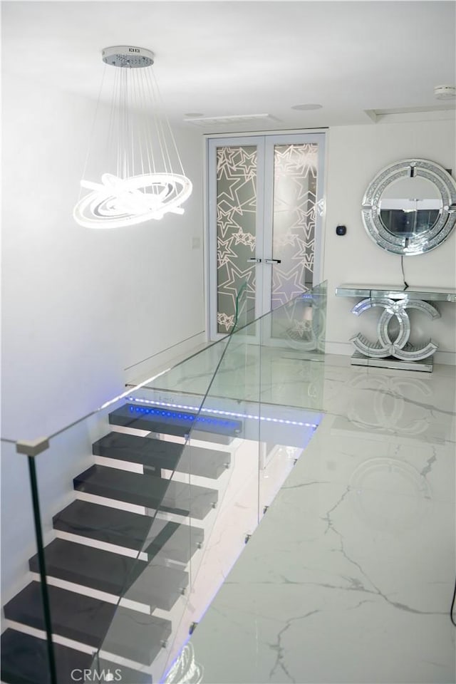 9359 Cecilia St, Downey, CA 90241 - staircase with a chandelier and marble finish flooring