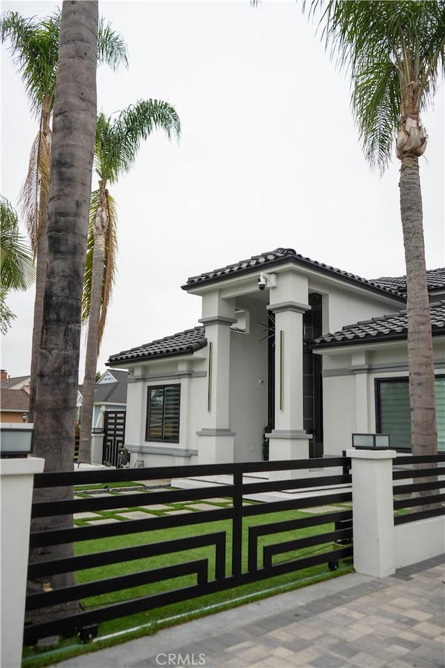 9359 Cecilia St, Downey, CA 90241 - view of front of house featuring a tiled roof, stucco siding, and a fenced front yard