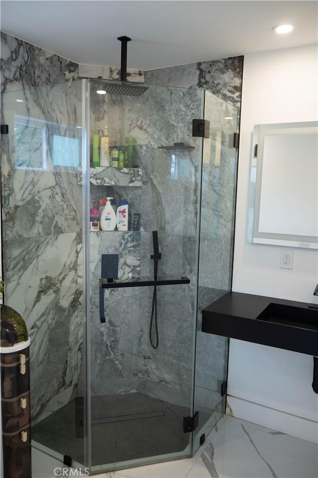 9359 Cecilia St, Downey, CA 90241 - bathroom with marble look tiles, a marble finish shower, and vanity