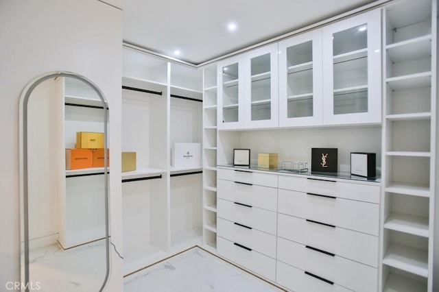 9359 Cecilia St, Downey, CA 90241 - walk in closet featuring light marble finish floors