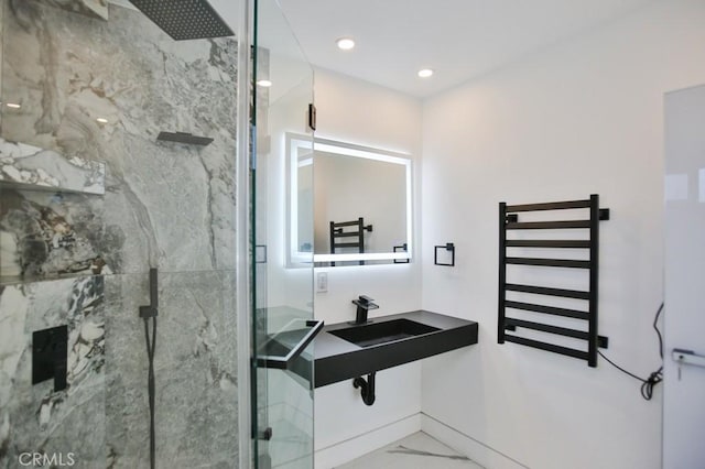 9359 Cecilia St, Downey, CA 90241 - bathroom with a towel warmer, a marble finish shower, radiator heating unit, marble look tile flooring, and recessed lighting
