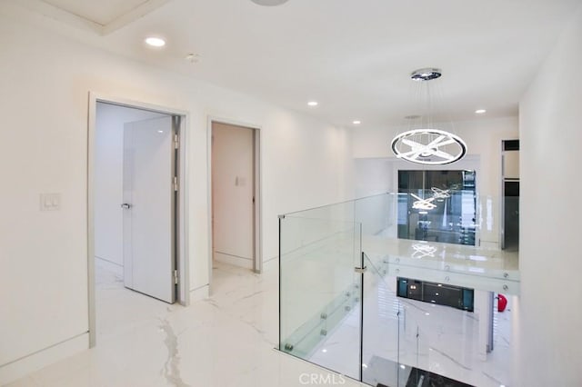 9359 Cecilia St, Downey, CA 90241 - corridor featuring marble finish flooring, a chandelier, and recessed lighting