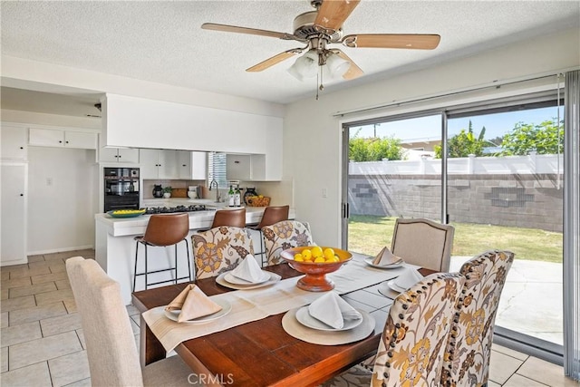 1941 W 235th Pl, Torrance, CA 90501 - dining space with light tile patterned floors, a textured ceiling, and ceiling fan