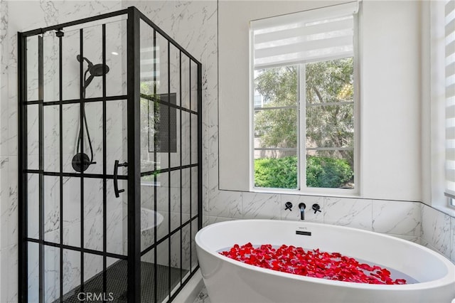 3 Kyle Ct, Ladera Ranch, CA 92694 - bathroom featuring a shower stall, a freestanding tub, and tile walls