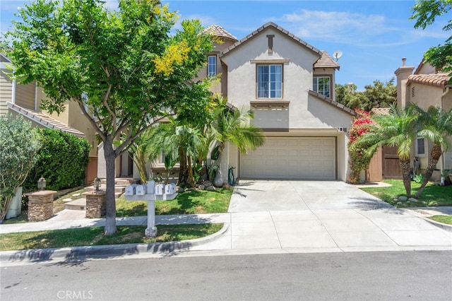 3 Kyle Ct, Ladera Ranch, CA 92694 - mediterranean / spanish-style home with a garage, stucco siding, driveway, and a tiled roof