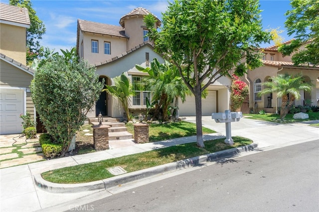 3 Kyle Ct, Ladera Ranch, CA 92694 - mediterranean / spanish-style home with driveway, stucco siding, a tile roof, and a garage
