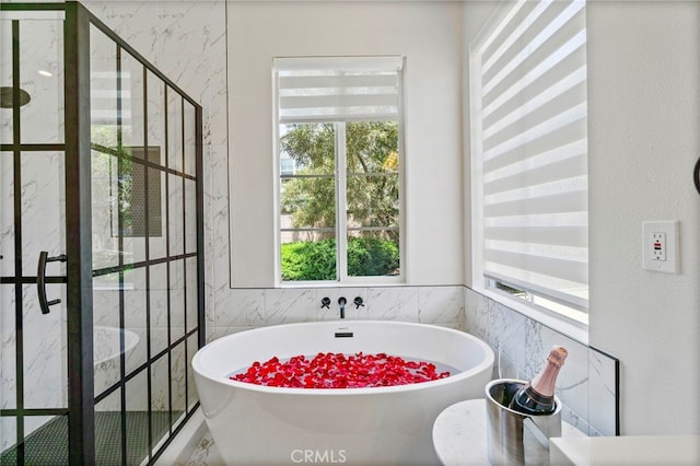 3 Kyle Ct, Ladera Ranch, CA 92694 - full bathroom featuring plenty of natural light, a freestanding bath, tile walls, and a stall shower