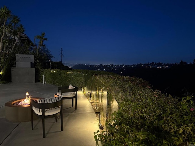 6544 Caminito Northland Ln, Jolla, CA 92037 - patio at night with a fire pit and a patio area