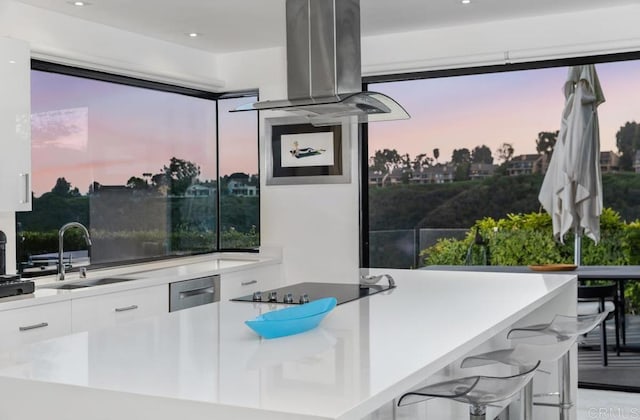 6544 Caminito Northland Ln, Jolla, CA 92037 - kitchen with modern cabinets, white cabinetry, island exhaust hood, black electric cooktop, and recessed lighting