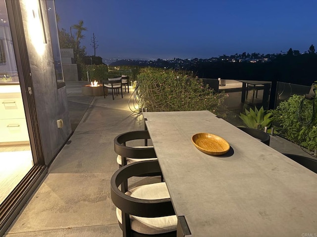 6544 Caminito Northland Ln, Jolla, CA 92037 - patio at twilight with a fire pit and a patio area