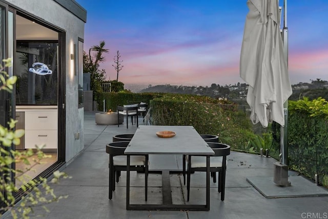 6544 Caminito Northland Ln, Jolla, CA 92037 - patio terrace at dusk featuring outdoor dining space and a patio