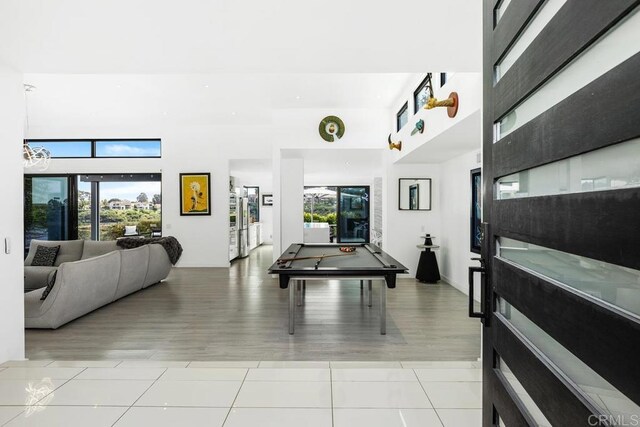 6544 Caminito Northland Ln, Jolla, CA 92037 - foyer entrance featuring light tile patterned floors, a towering ceiling, and billiards