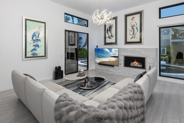 6544 Caminito Northland Ln, Jolla, CA 92037 - living area with a high end fireplace, wood finished floors, and a chandelier