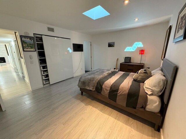 6544 Caminito Northland Ln, Jolla, CA 92037 - bedroom featuring a skylight and wood finished floors