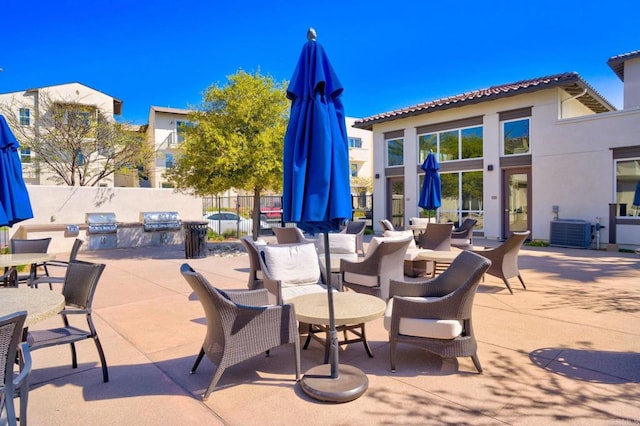 5252 Beachfront Cove St Unit 197, San Diego, CA 92154 - view of patio / terrace featuring exterior kitchen and outdoor dining area