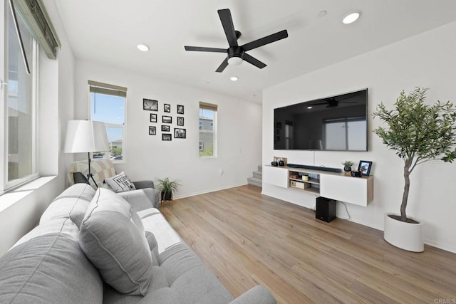 5252 Beachfront Cove St Unit 197, San Diego, CA 92154 - living room featuring light wood-type flooring, ceiling fan, recessed lighting, and stairway