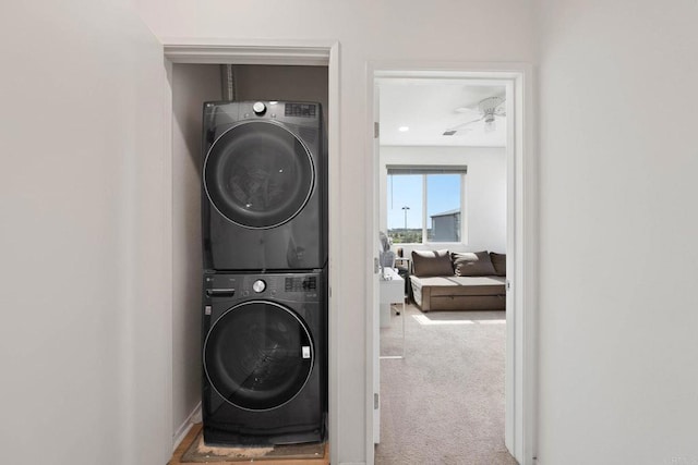 5252 Beachfront Cove St Unit 197, San Diego, CA 92154 - washroom featuring stacked washer / dryer and carpet