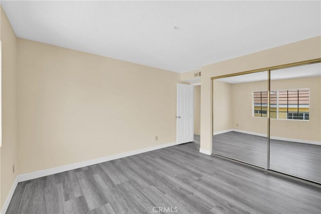 519 Sefton Ave Unit D, Monterey Park, CA 91755 - unfurnished bedroom with wood finished floors and a closet