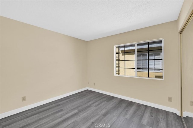 519 Sefton Ave Unit D, Monterey Park, CA 91755 - empty room with dark wood-style floors and a textured ceiling