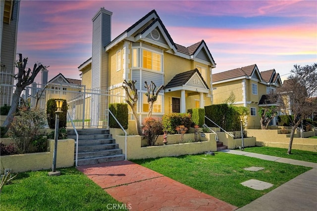519 Sefton Ave Unit D, Monterey Park, CA 91755 - view of front of property with a yard, a chimney, and stucco siding