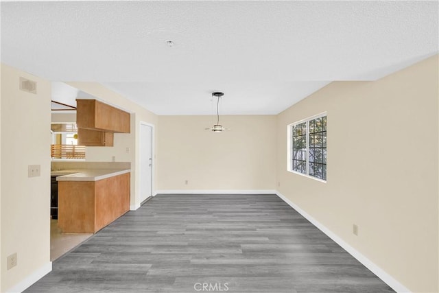 519 Sefton Ave Unit D, Monterey Park, CA 91755 - unfurnished dining area featuring wood finished floors and baseboards