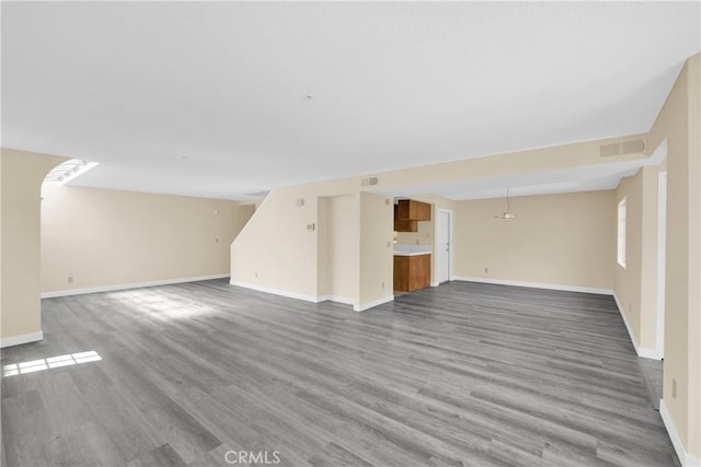 519 Sefton Ave Unit D, Monterey Park, CA 91755 - unfurnished living room with wood finished floors and baseboards