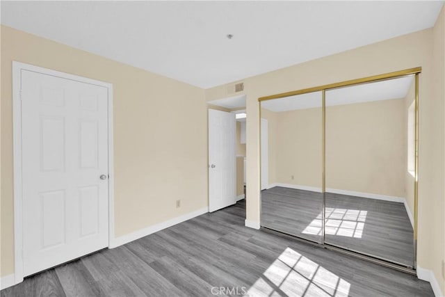 519 Sefton Ave Unit D, Monterey Park, CA 91755 - unfurnished bedroom featuring wood finished floors and a closet