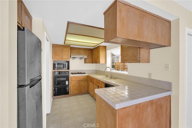 519 Sefton Ave Unit D, Monterey Park, CA 91755 - kitchen featuring freestanding refrigerator, oven, gas cooktop, under cabinet range hood, and a warming drawer