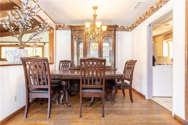 6644 Bothwell Rd, Reseda, CA 91335 - dining area with a chandelier and wood finished floors