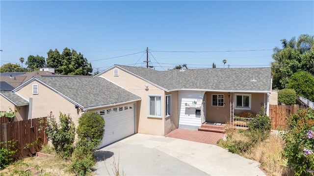6644 Bothwell Rd, Reseda, CA 91335 - single story home with stucco siding, a shingled roof, a garage, concrete driveway, and a porch