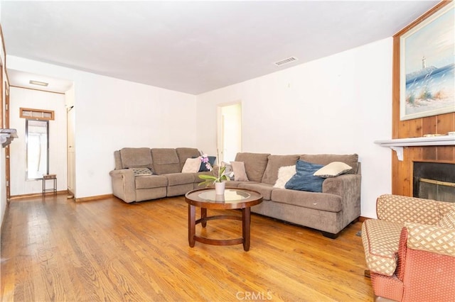 6644 Bothwell Rd, Reseda, CA 91335 - living room with light wood finished floors and a tile fireplace