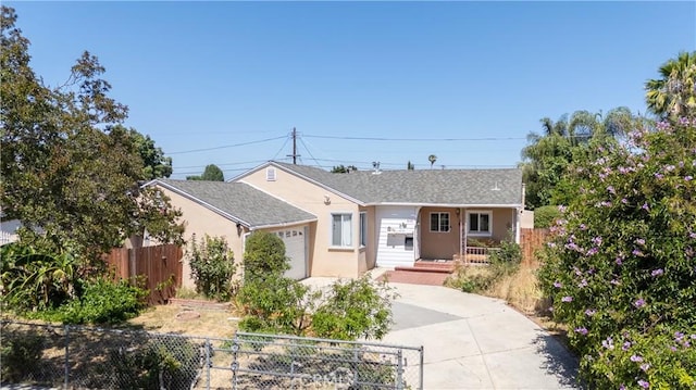 6644 Bothwell Rd, Reseda, CA 91335 - view of front facade with a garage, concrete driveway, and stucco siding