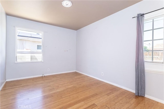6644 Bothwell Rd, Reseda, CA 91335 - unfurnished room with light wood finished floors and baseboards