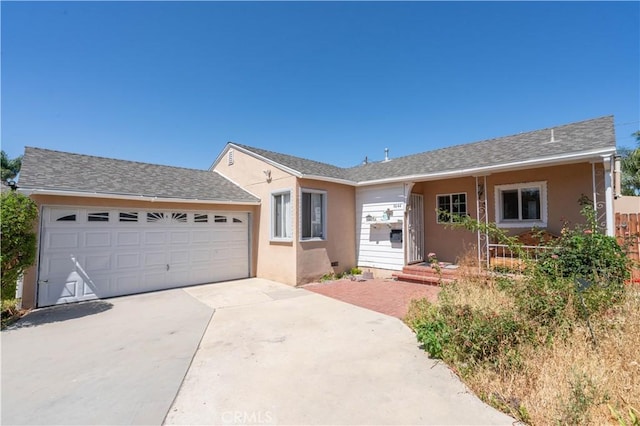 6644 Bothwell Rd, Reseda, CA 91335 - ranch-style house featuring stucco siding, an attached garage, driveway, and a shingled roof