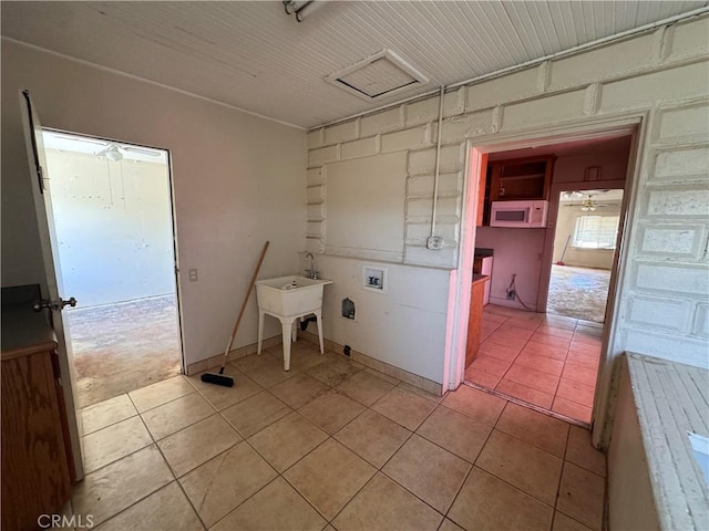29095 Arrowhead Ave, Barstow, CA 92311 - washroom with hookup for a washing machine and light tile patterned floors
