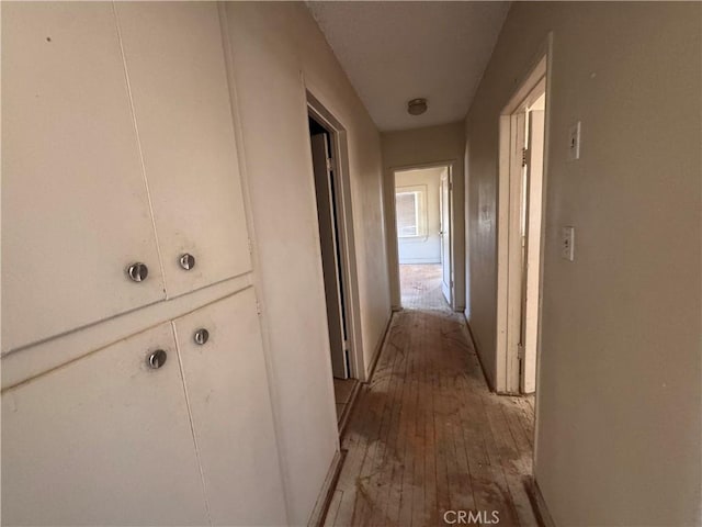29095 Arrowhead Ave, Barstow, CA 92311 - corridor featuring hardwood / wood-style floors and baseboards
