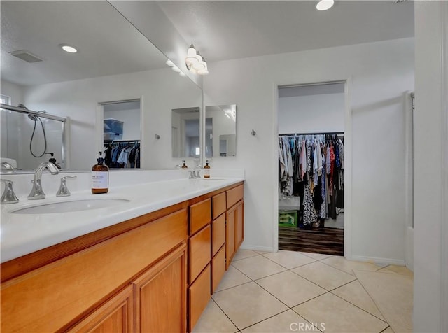 205 W Sparkleberry Ave, Orange, CA 92865 - full bath with a spacious closet, double vanity, tile patterned flooring, a shower stall, and recessed lighting