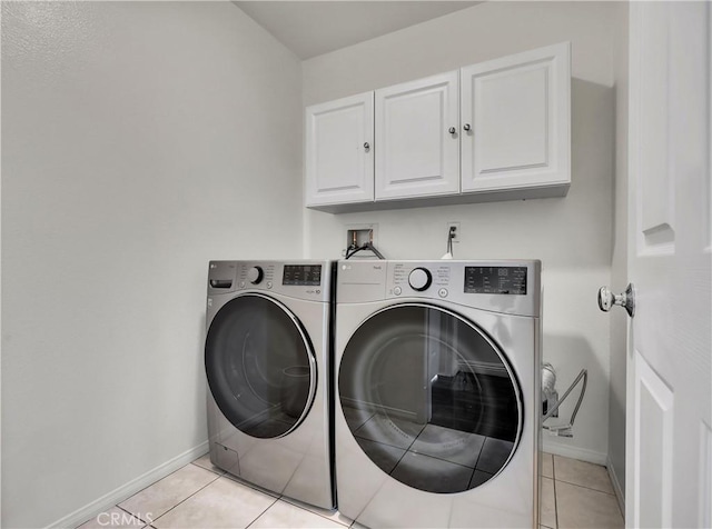 205 W Sparkleberry Ave, Orange, CA 92865 - laundry area featuring cabinet space, light tile patterned flooring, and washer and dryer
