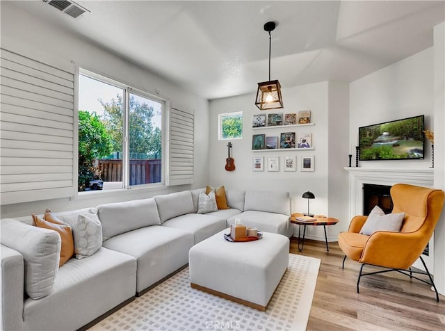 205 W Sparkleberry Ave, Orange, CA 92865 - living area with light wood-type flooring and a fireplace