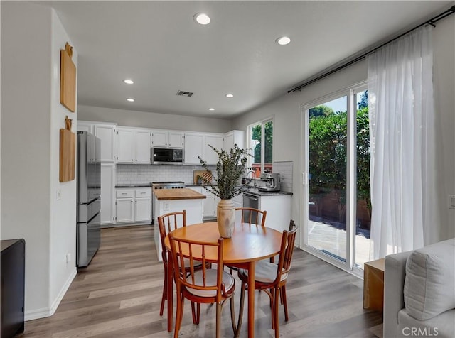 205 W Sparkleberry Ave, Orange, CA 92865 - dining room featuring light wood-style flooring and recessed lighting