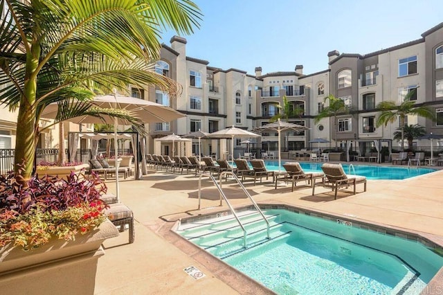 9263 Regents Rd Unit B106, La Jolla, CA 92037 - community pool featuring a hot tub and a patio