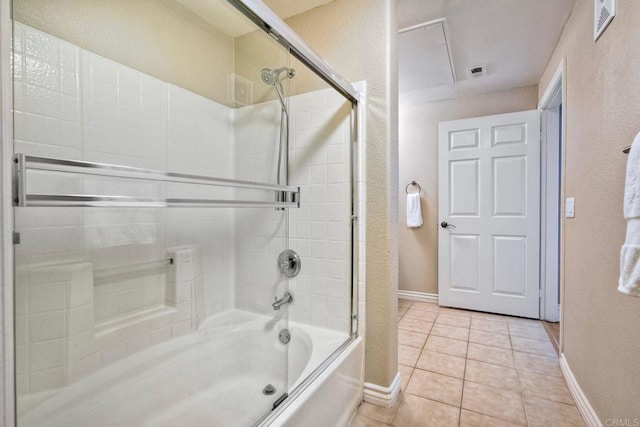 9263 Regents Rd Unit B106, La Jolla, CA 92037 - bathroom featuring shower / bath combination with glass door, tile patterned floors, and a textured wall