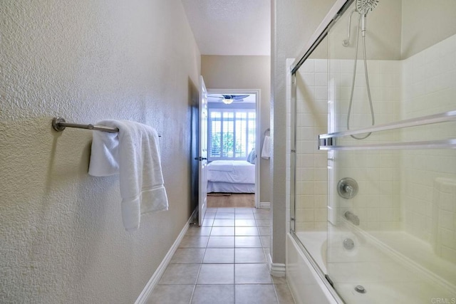 9263 Regents Rd Unit B106, La Jolla, CA 92037 - bathroom with a textured wall, enclosed tub / shower combo, tile patterned floors, ensuite bath, and a ceiling fan