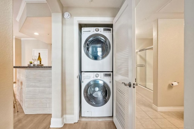 9263 Regents Rd Unit B106, La Jolla, CA 92037 - laundry area with stacked washer / drying machine and attic access