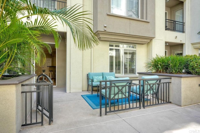 9263 Regents Rd Unit B106, La Jolla, CA 92037 - view of patio featuring an outdoor hangout area