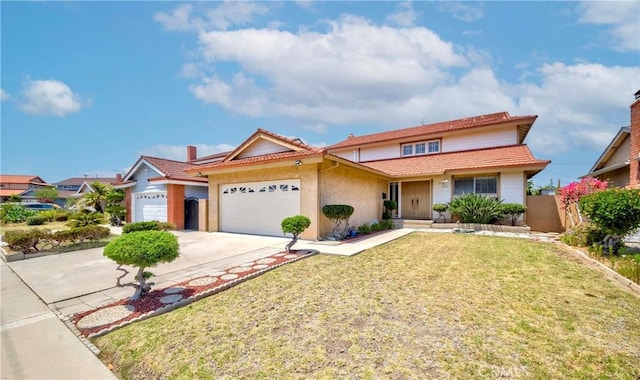 2033 W 169th Pl, Torrance, CA 90504 - view of front of property featuring an attached garage, concrete driveway, a tile roof, and stucco siding
