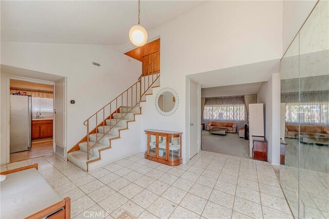 2033 W 169th Pl, Torrance, CA 90504 - stairs featuring high vaulted ceiling and tile patterned flooring