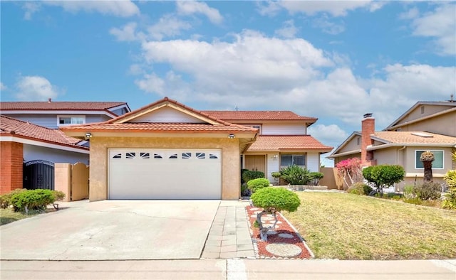 2033 W 169th Pl, Torrance, CA 90504 - view of front of house featuring a garage, stucco siding, a tile roof, concrete driveway, and a front yard