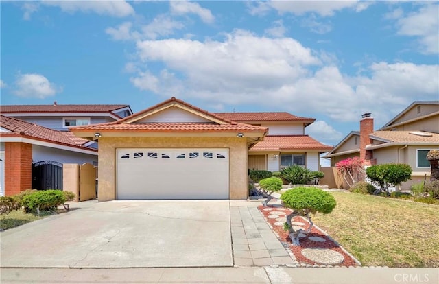 2033 W 169th Pl, Torrance, CA 90504 - view of front of home featuring stucco siding, an attached garage, concrete driveway, a tile roof, and a gate